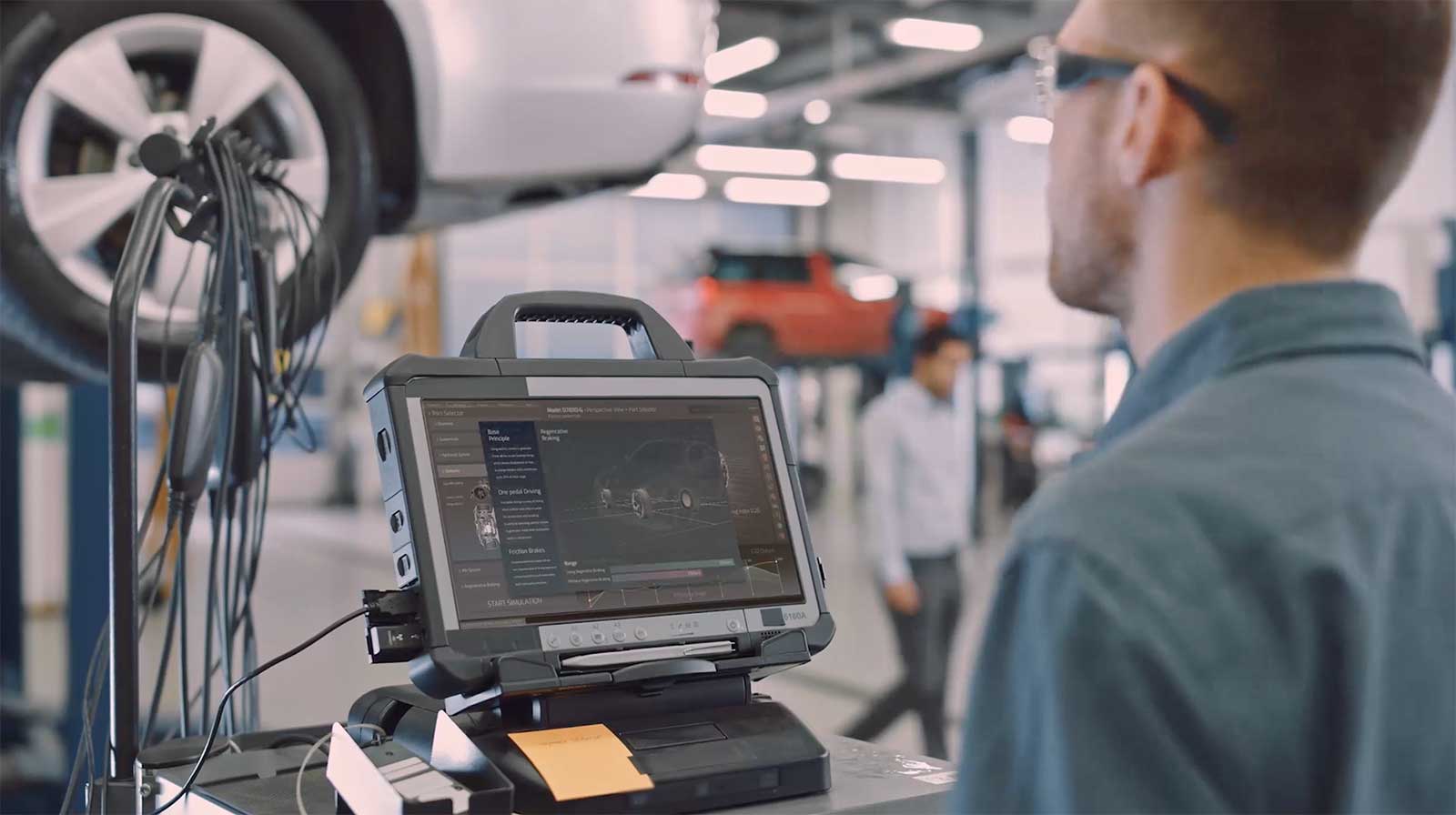 Mechanic at dealership uses an AI software to search for how to complete a complex process.