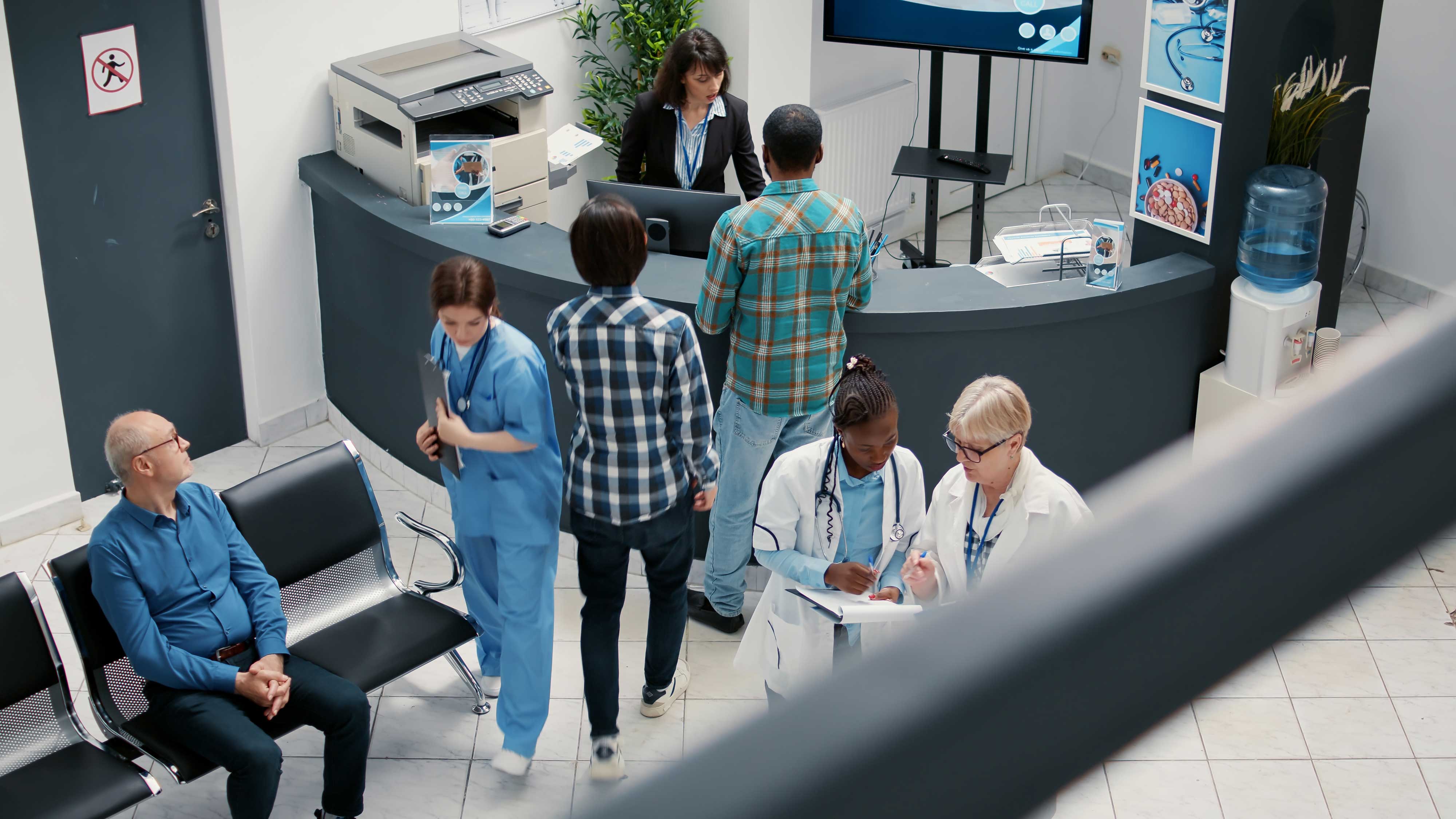 Overhead view of a busy hospital waiting room.