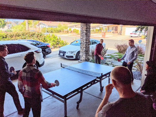 Some of the TSG team playing ping-pong together at an on-site workshop in Southern California.