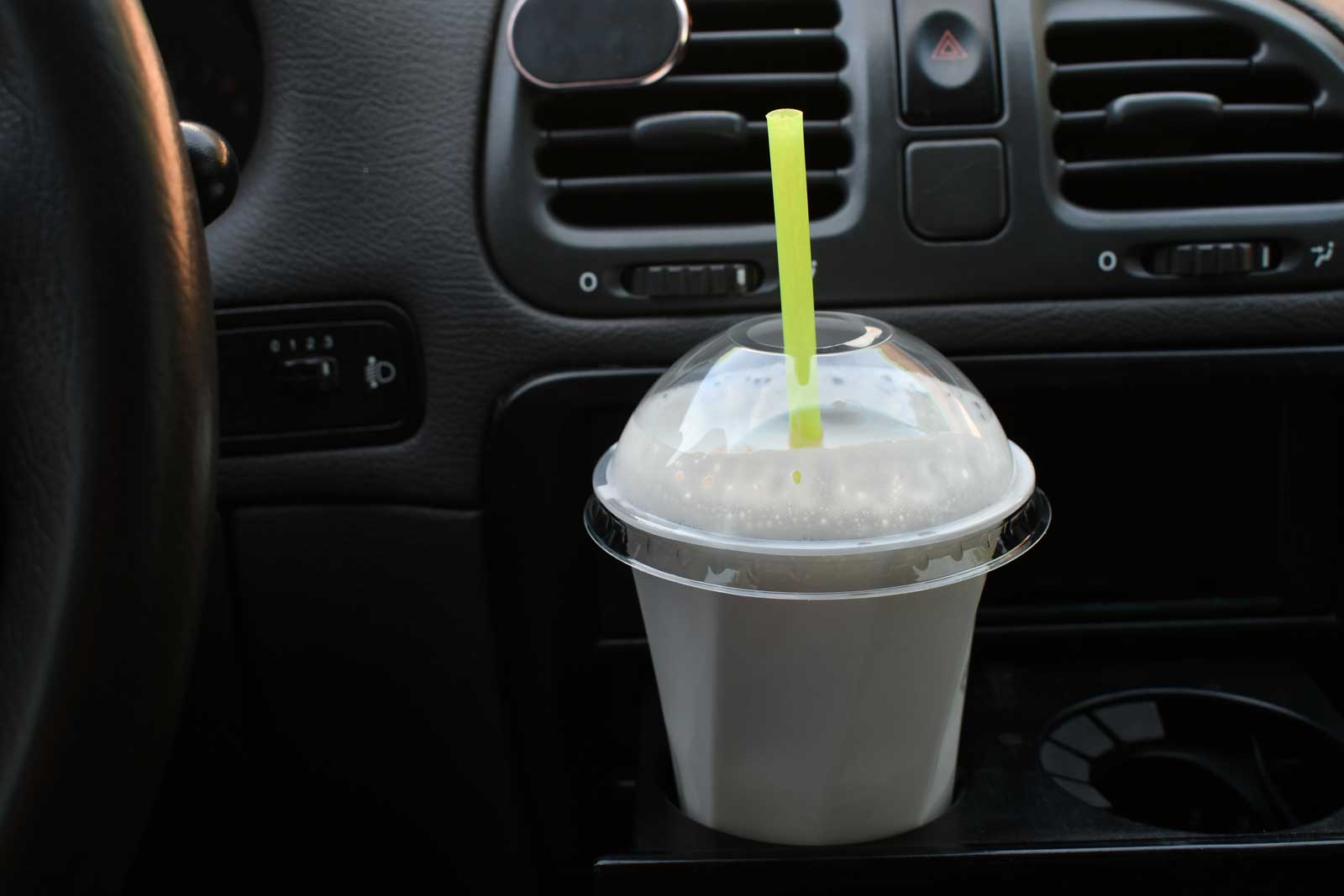McDonald's milkshake in car cupholder