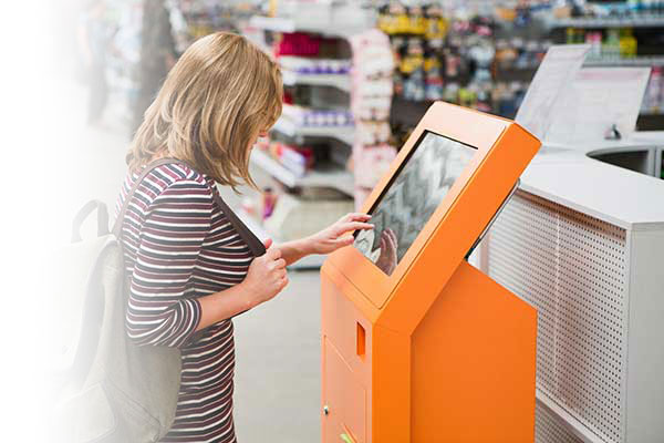 Woman at kiosk in home improvement store.